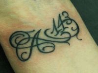 tattoo-tatuaje-amor-de-madre-zamora-infinito-infinity-143-A-inicial-mueca